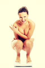 Obraz premium Naked woman on a scope.