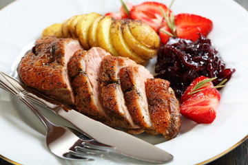 Duck breast with a sauce of red onion.