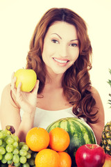 Obraz premium Beautiful woman with fruits