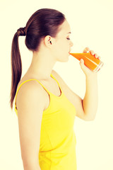 Young woman with the carrots juice