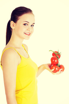 Young woman with tomato.