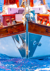 Fototapeta na wymiar Bow of a classic wooden sailing boat in Spetses island in Greece