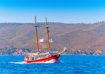 Fototapeta na wymiar Old wooden red Greek boat (Perama) in Spetses island in Greece
