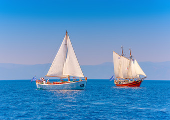 Fototapeta premium 2 Old classic wooden sailing boats in Spetses island in Greece
