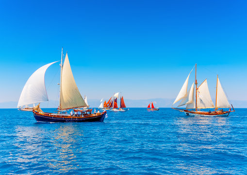several old wooden sailing boats in Spetses island in Greece