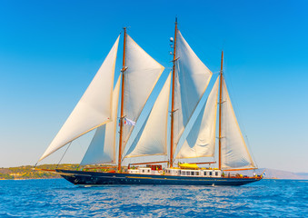 Fototapeta na wymiar A Big 3 mast classic sailing boat in Spetses island in Greece