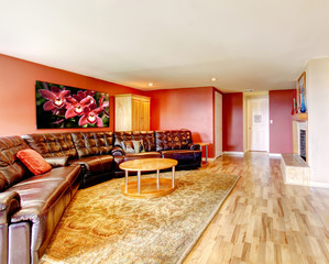 Spacious living room with black large couch