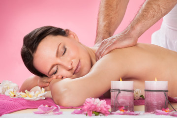 Fototapeta na wymiar Woman Receiving Back Massaging In Spa