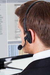 Call Center Consultant Wearing Headset In Office