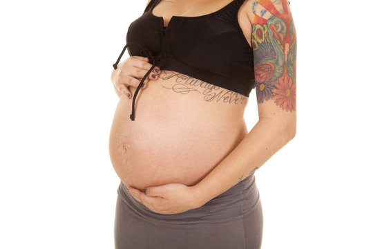 pregnant belly close tattoos bikni top