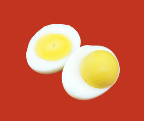 Boiled egg on red background