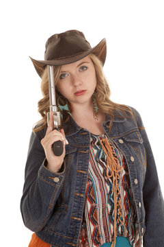woman pistol on hat serious