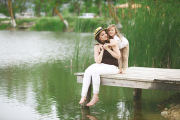 Fototapeta premium Family resting near pond
