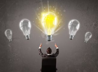 Business person having an idea light bulb concept