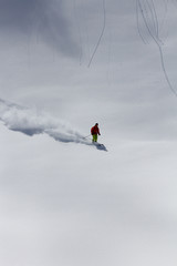 Skier in deep powder, extreme freeride