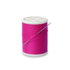 Spool of thread with needle isolated on white