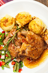 Pork spareribs served with mashed potatoes