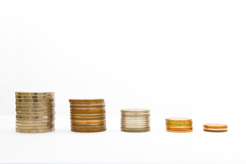 Stacks of coins on white background