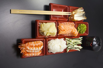 Ingredients for sushi: sliced salmon cucumber rice 
