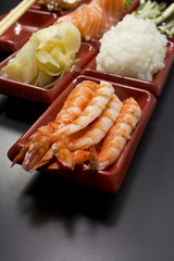 Ingredients for sushi: sliced salmon cucumber rice 