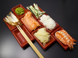 Ingredients for sushi: sliced salmon cucumber rice 