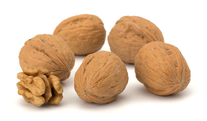 whole and cracked walnut isolated on the white background