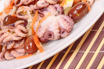 octopus salad olives, carrots , lemon