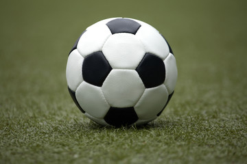 White and black ball for playing soccer close-up