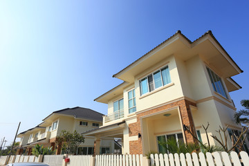 Fototapeta na wymiar Big house modern style with sunshine and blue sky background