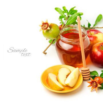 Honey And Apples With Pomegranate Over White Background