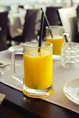 Glass of orange juice in restaurant