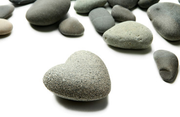 Fototapeta na wymiar Grey stones in shape of heart, isolated on white