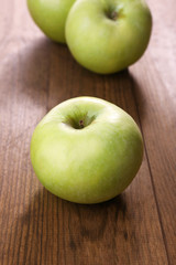 Apples on wooden background
