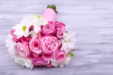 Beautiful wedding bouquet on wooden background