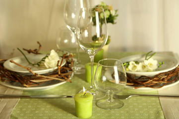 Beautiful holiday Easter table setting in green tones,