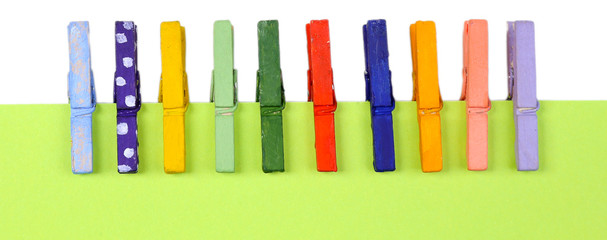 Abstract background with colorful wooden pins and paper