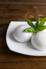 Tasty mozzarella cheese with basil