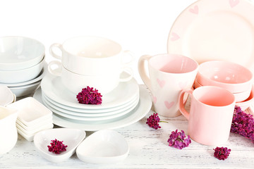 Different tableware on shelf, isolated on white