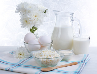 Tasty dairy products on wooden table