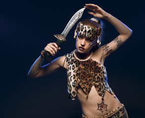 Beautiful female fighter with a sword in her hands.