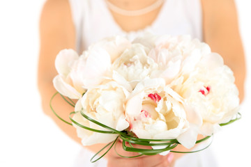 Fototapeta na wymiar Bride holding wedding bouquet of white peonies, close-up