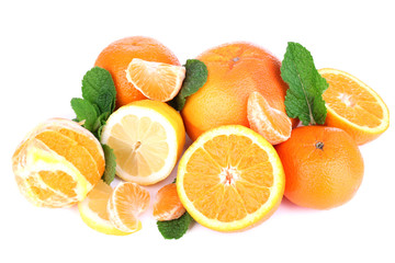 Fresh citrus fruits with green leaves isolated on white