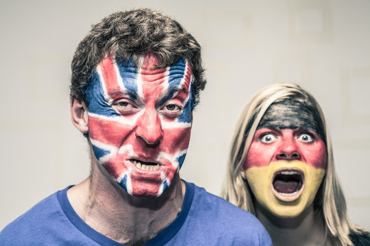 Scary couple with British and German flag on face