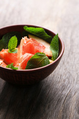 Ripe chopped grapefruit with mint leaves