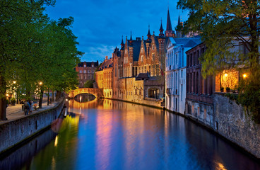 Fototapeta premium Historic medieval buildings along a canal in Bruges, Belgium
