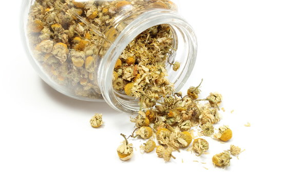 Heap Of Dried Chamomile In Glass Jar