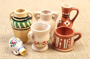 Decorative ceramic vases on jute canvas
