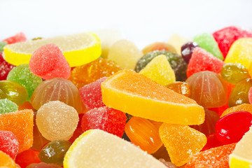 Fototapeta na wymiar Colorful fruity candies and jelly close up