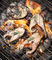 Grilled salmon steaks on fire