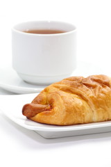 Classical breakfast a croissant sausage and cheese